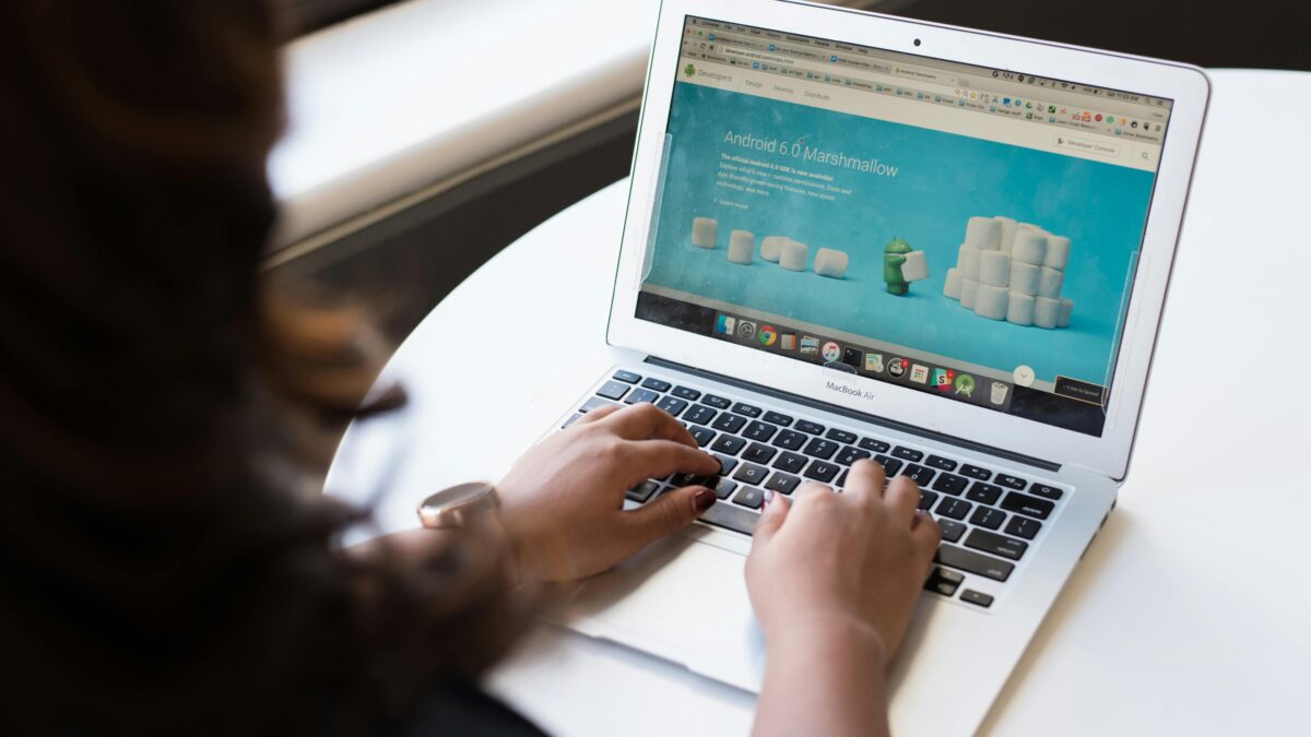a person is working on a laptop displaying landing page design