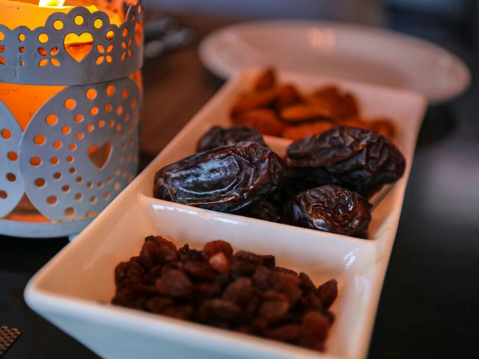 A closeup shot of dates and raisins in a dish for Ramadan.