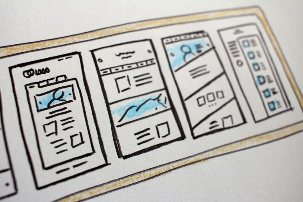 A website's design is sketched out on a paper
