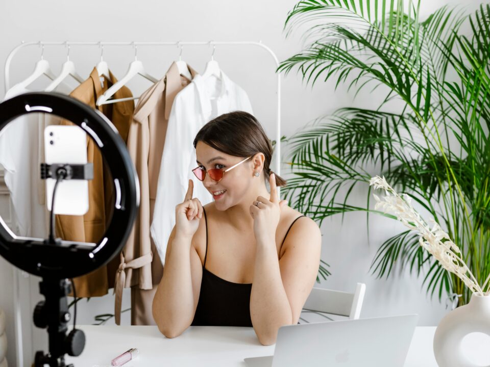 A female influencer is busy making a new video for her IG account.