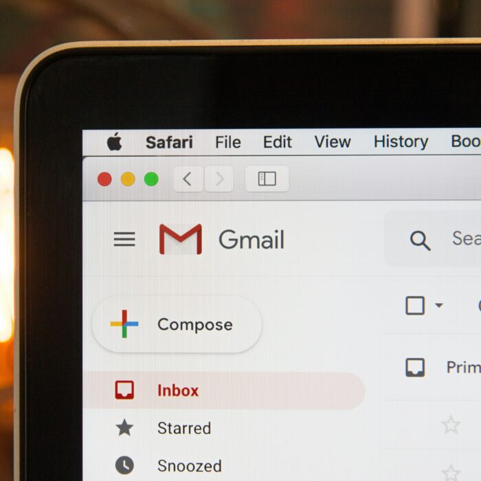 A laptop displaying emails on Gmail.