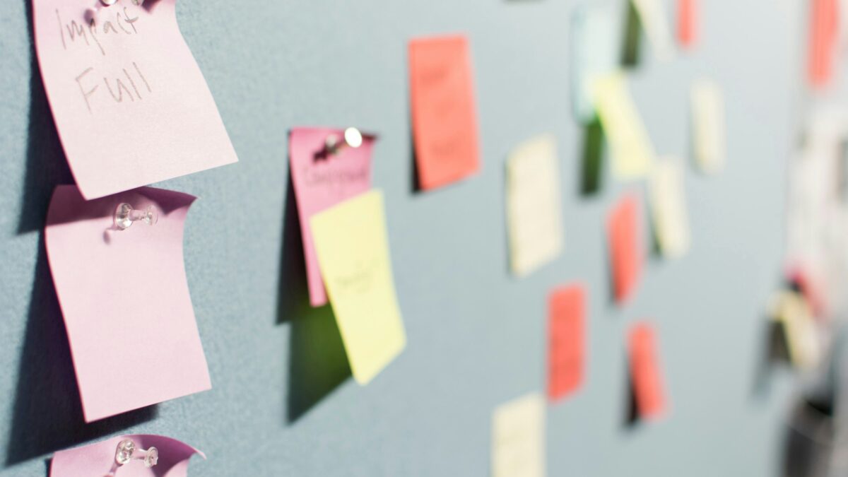 A soft board pinned with sticky notes mapping content strategy.