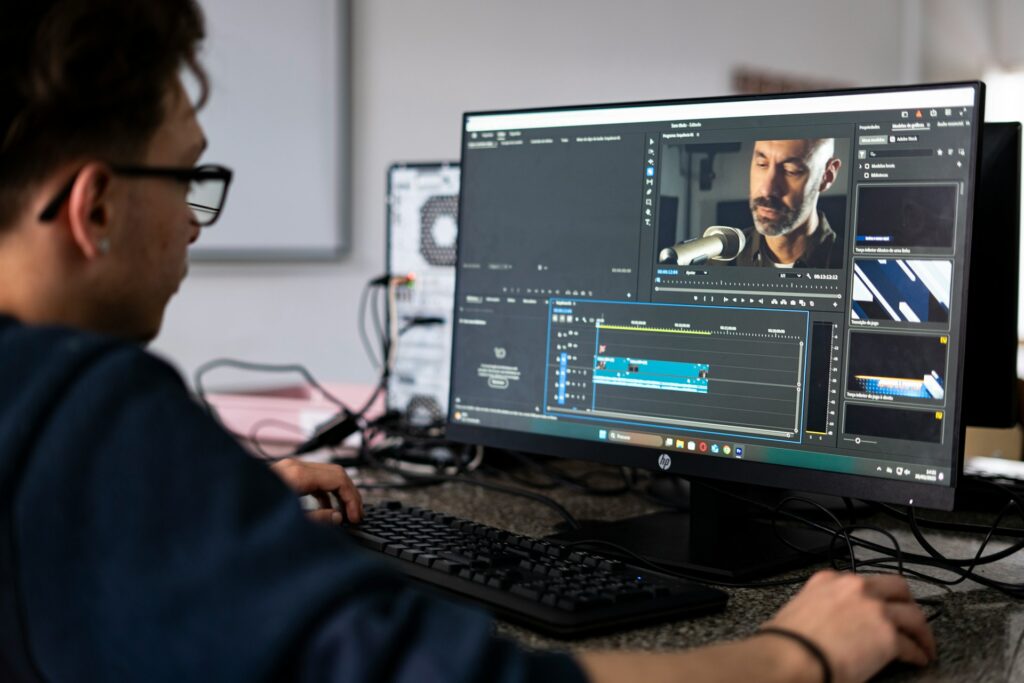 Video Editor at Work Man working on a video editing project using professional software.